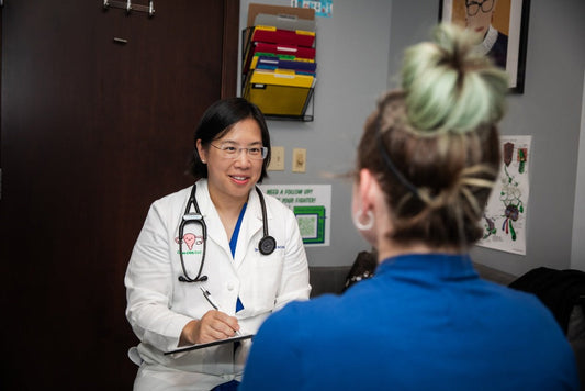 Dr. Chinn talks with patient about breast care